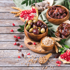 Tu Bishvat holiday symbols - dried fruits, pomegranate, barley, wheat